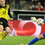 Dortmund beat 10-man Cologne 2-1
